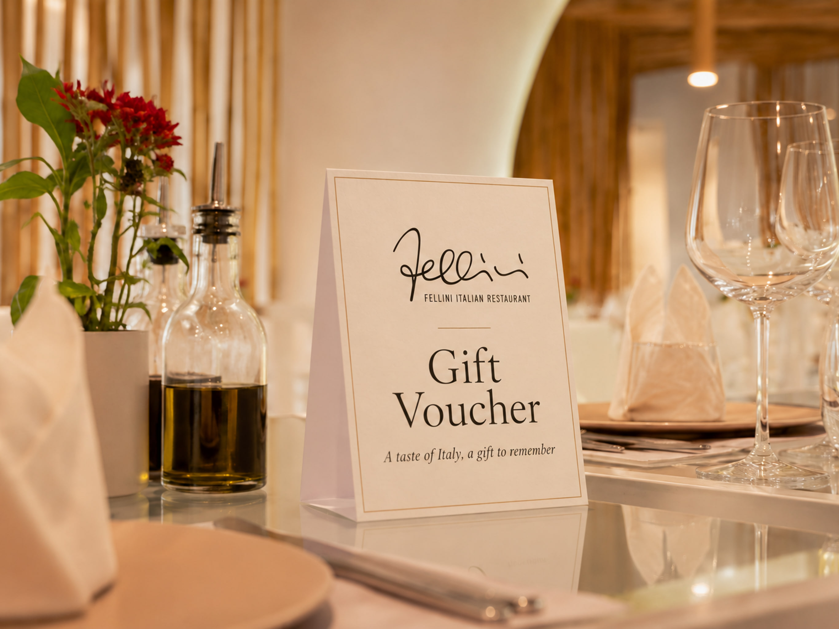 Fellini gift voucher displayed on a restaurant table
